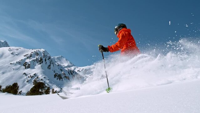 Super slow motion of free ride skier in powder snow. Filmed on high speed cinema camera, 1000fps.
