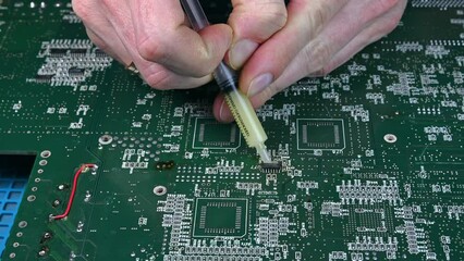 Dismantling the microchip using a soldering station. 