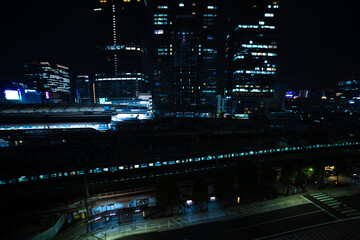 Fototapeta na wymiar A night panoramic cityscape in front of Tokyo station wide shot