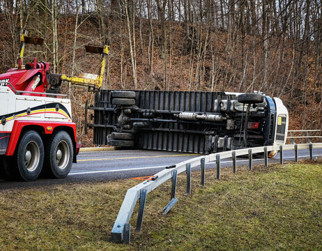 A Box Truck blocks both lanes of Route 79 in Windsor in Upstate NY.  Accident with a delivery truck on its side blocking a rural road.