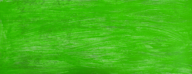 fresh green paint on wooden background