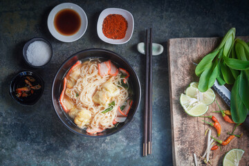 egg noodles with pork wonton soup or pork dumplings soup and vegetable - Asian food style