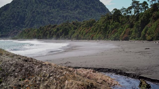 grey volcanic beach close to Chaiten in Patagonia