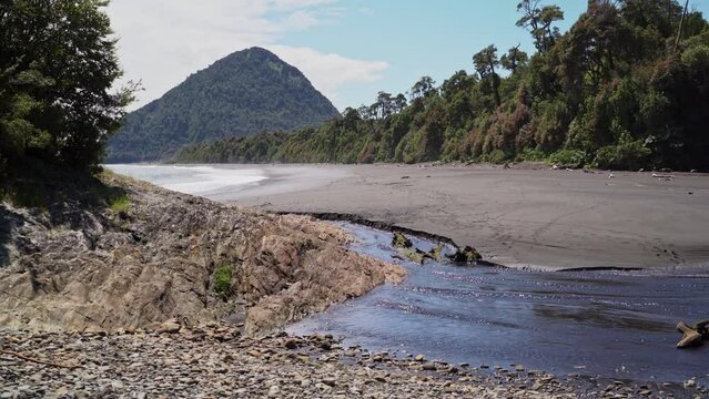 grey volcanic beach close to Chaiten in Patagonia