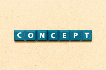 Tile alphabet letter in word concept on wood background