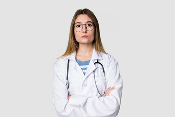 Young female doctor confidently gazing at the camera.