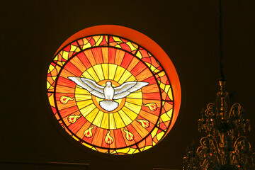 Stained glass windows with images of saints in church of st benedict in Guararema city, Sao Paulo...