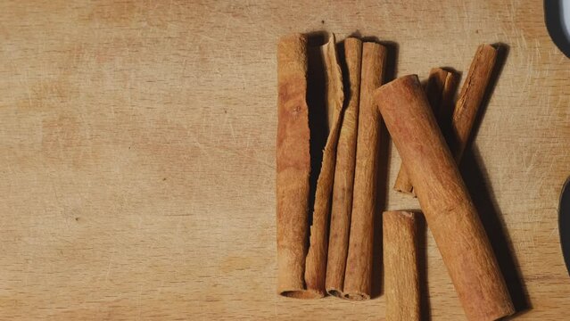cinnamon sticks on wooden table