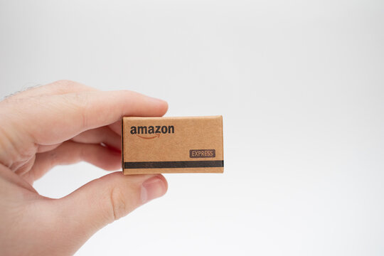Miniature amazon cardboard box in hand