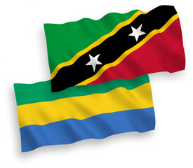 Flags of Federation of Saint Christopher and Nevis and Gabon on a white background