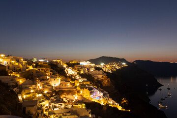 view of Oia village on Santorini island at sunset