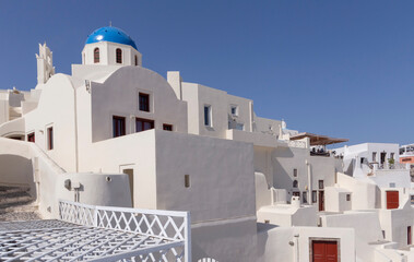 whitewashed houses and chapel in Oia village on Santorini island