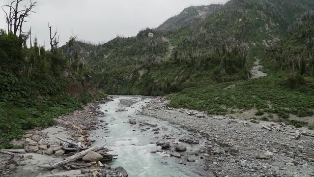 river running through the volcanic landscape of Chaiten