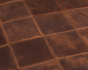 Background of hand-stitched square pieces of genuine brown leather
