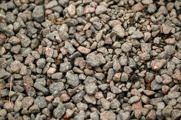 Small black and grey pebbles stone backdrop
