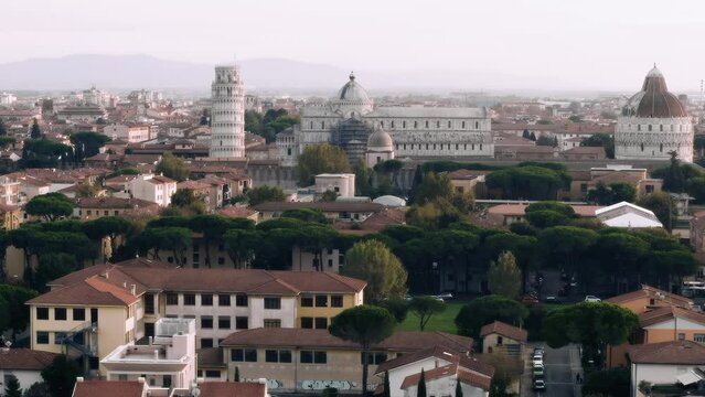 Drone panorama of Pisa, Italy, a medieval European tourist city center in Tuscany by sunset, 4K