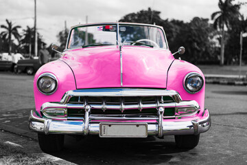 colorkey of pink classic car on the street of havana cuba