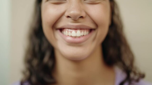 Young african american woman smiling confident at street