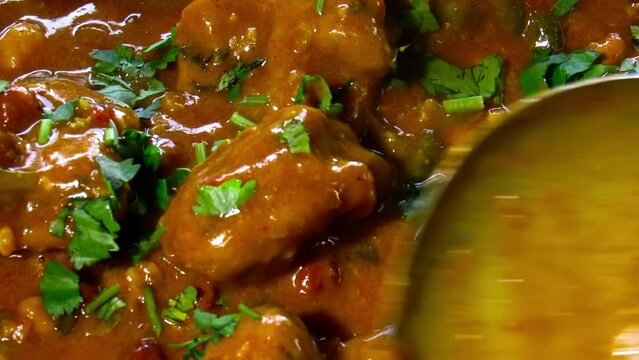 Shot of freshly prepared FISH DHOKLA or FISH DHOKRA an Indian dish similar to stew with all the vegetables and fish pieces in it. HD footage.
