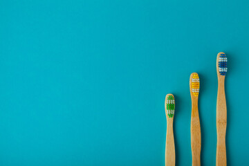 multiple bamboo toothbrush on blue background