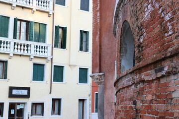 View of the Fondamenta del Monastero in Venice, Italy. Street scene, windows and balcony, old wall.