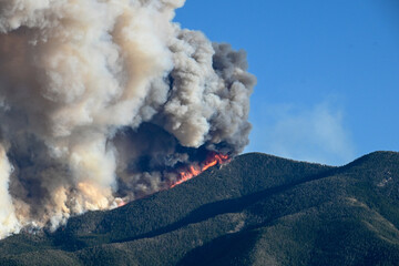 Mountain Wildfire with billowing smoke