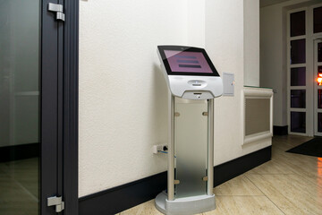 A modern touch screen terminal for customer service, an electronic queue in the service sector....