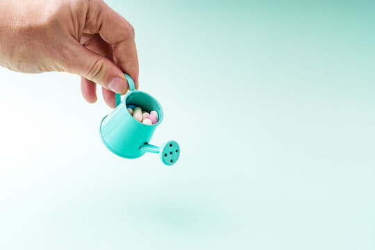 The concept of making a profit through dishonest means. Watering can with tablets as a symbol of steroids