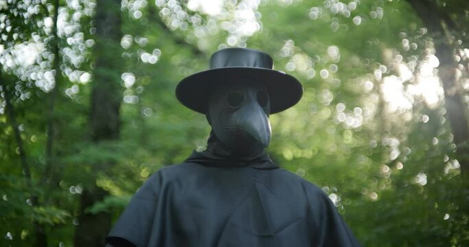Plague doctor in forest with lens flare and slow motion