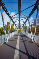 Fototapeta premium Truss bridge for pedestrians in the city