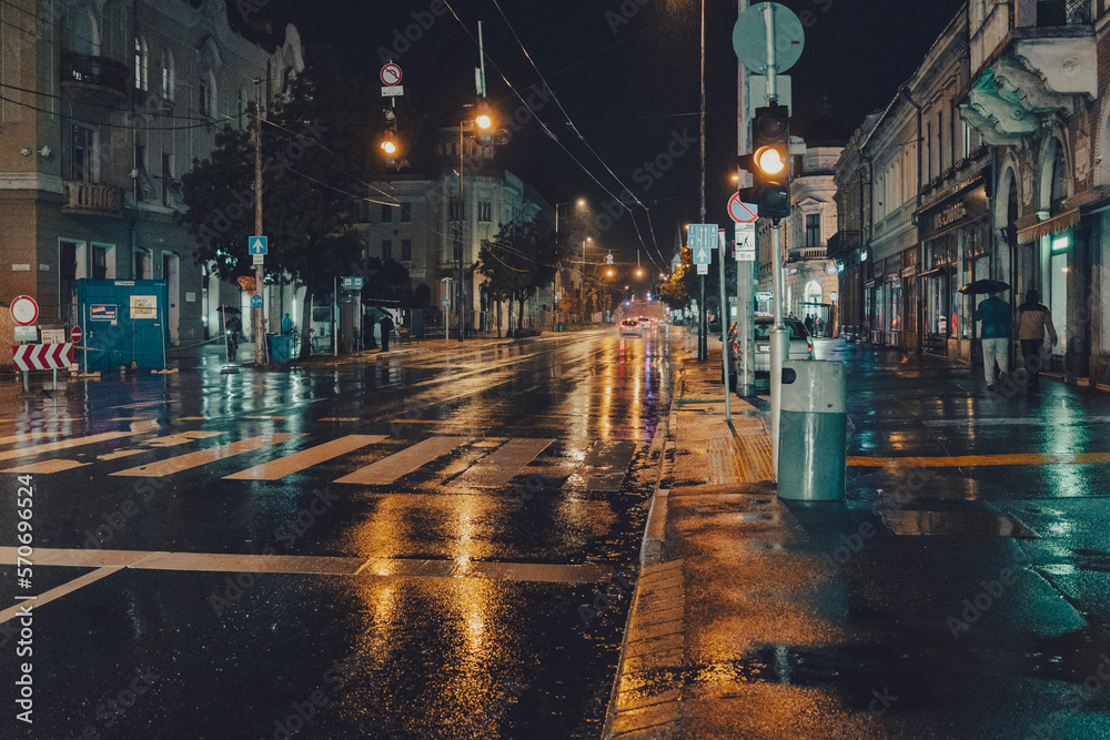 Wall mural wet rainy street at night in budapest hungary