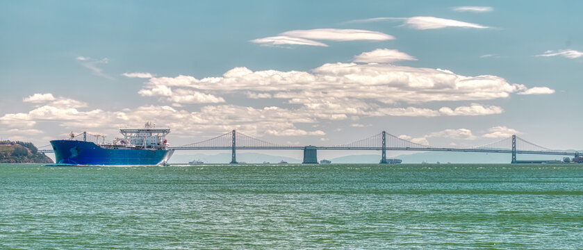 Blue Container Ship &ndash; San Francisco Bay with backdrop of the San Francisco - Oakland Bay Bridge