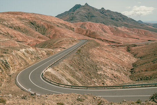 Winding road through the arid and cinematographic route of Fuerteventura, Canary Islands