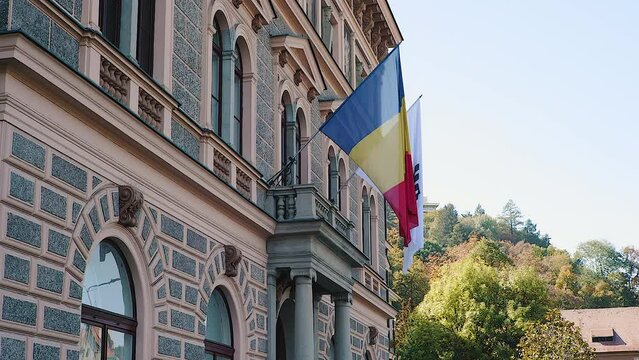 Romanian flag waving in Brasov, Transylvania, Romania on a sunny day