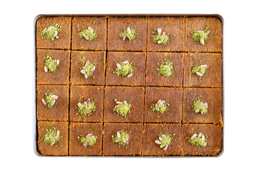 Kadayif with pistachio, cut into squares and garnished with pistachios on the tray