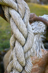Fototapeta na wymiar Beautiful old ship rope as decoration, detail.