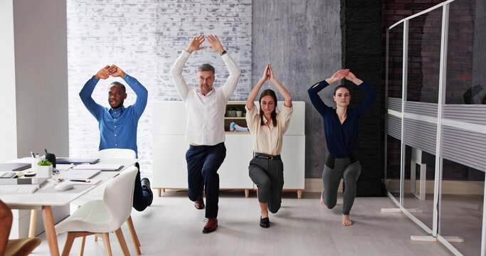 Happy Young Businesspeople Doing Stretching Exercise