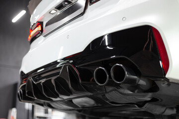 Modern and luxury sports car exhaust system pipes
