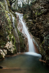 Fototapeta na wymiar Stunning and picturesque waterfall in Kiprianades village, North corfu, Greece