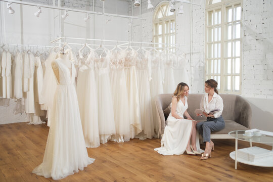 A Bride-To-Be shopping for a wedding dress in a Bridal Boutique.