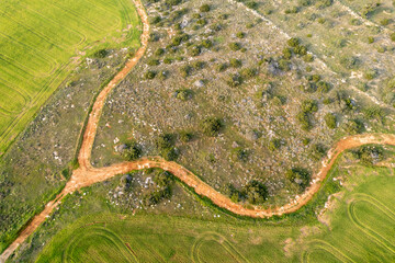 Drone aerial of rural road in the mountain. Hiking trail outdoor