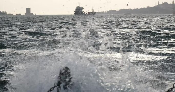 Seagulls flying over the choppy sea while the southwest wind blows in the Bosphorus