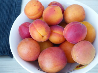 3. Colorful apricots on a white plate