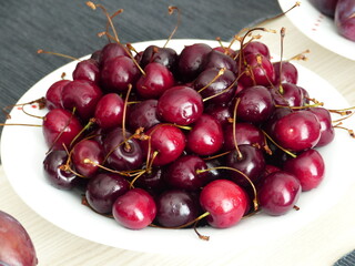 4. Red cherries on a white plate