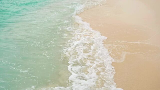 Turquoise tropical ocean waves on the beach