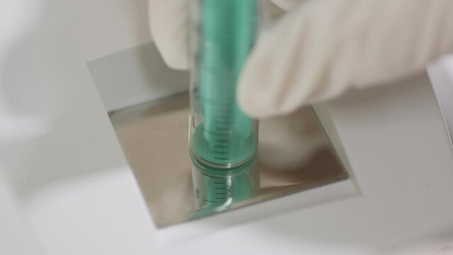 Close-up of burning needles in a medical destructor burning used syringes. Flashes of sparks. Disposal and disinfection.
