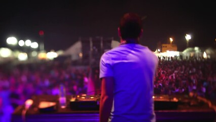 Dj playing to festival crowd