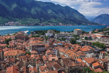 Naklejka na ściany i meble Aerial view of roofs of Old Town of Kotor town in Montenegro