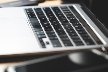 Work On Laptop Pc. Close up image of hands typing text or programming code using the computer at home.
Businessman working on laptop on the table.