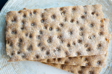 stack of whole meal cookies on wooden background